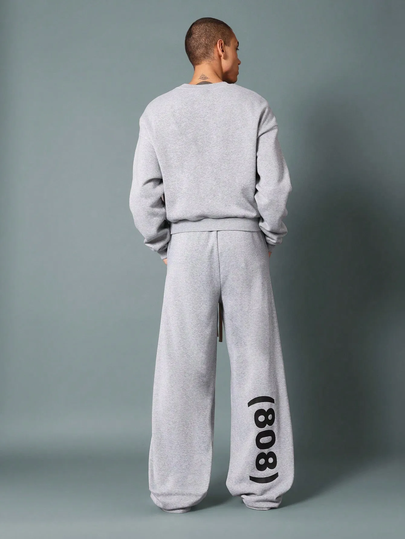 Wide Leg Drop Crotch Sweatpants With Pleats, Drawcords & Graphic Print